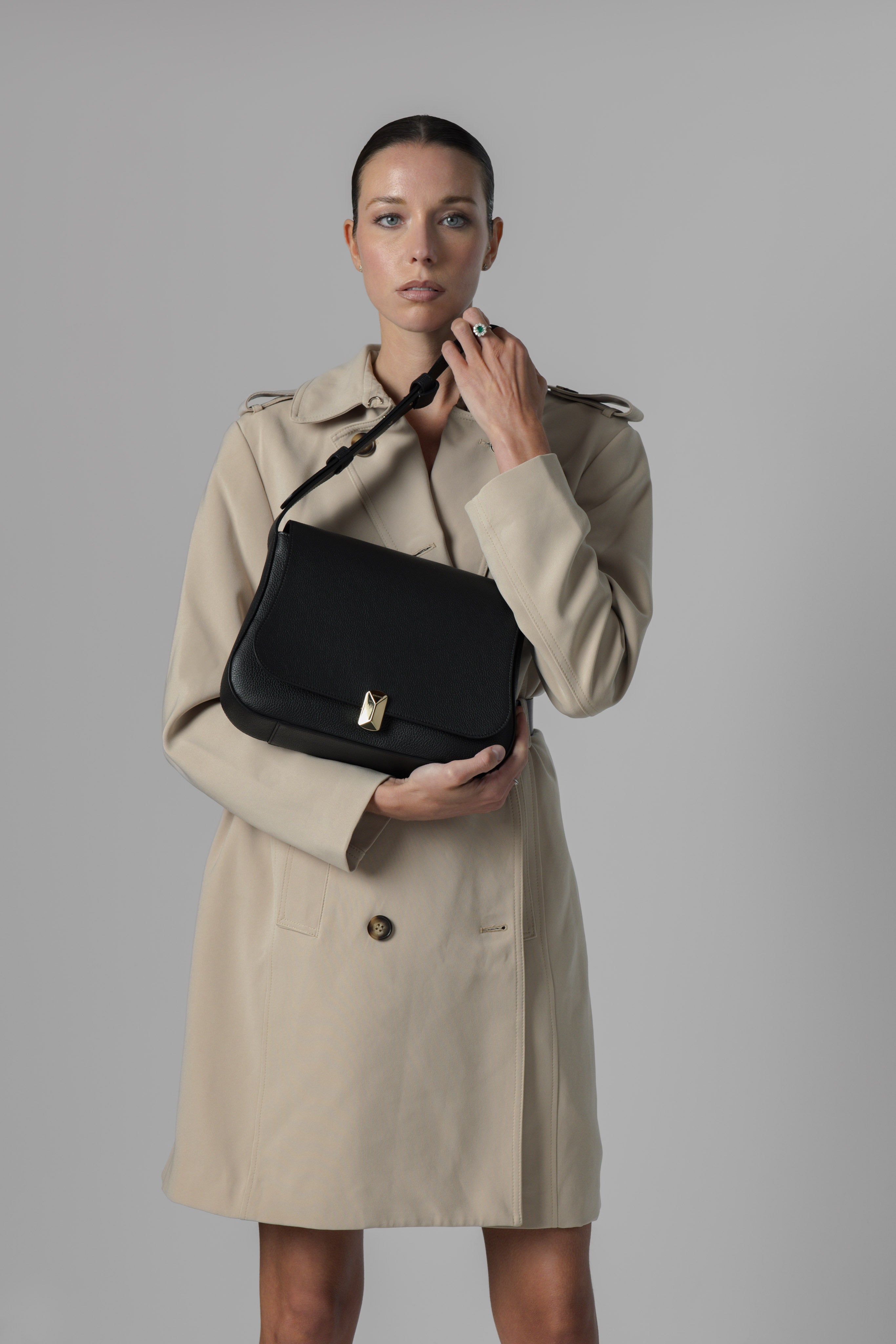 Woman carrying No. 14 black Italian leather shoulder bag
