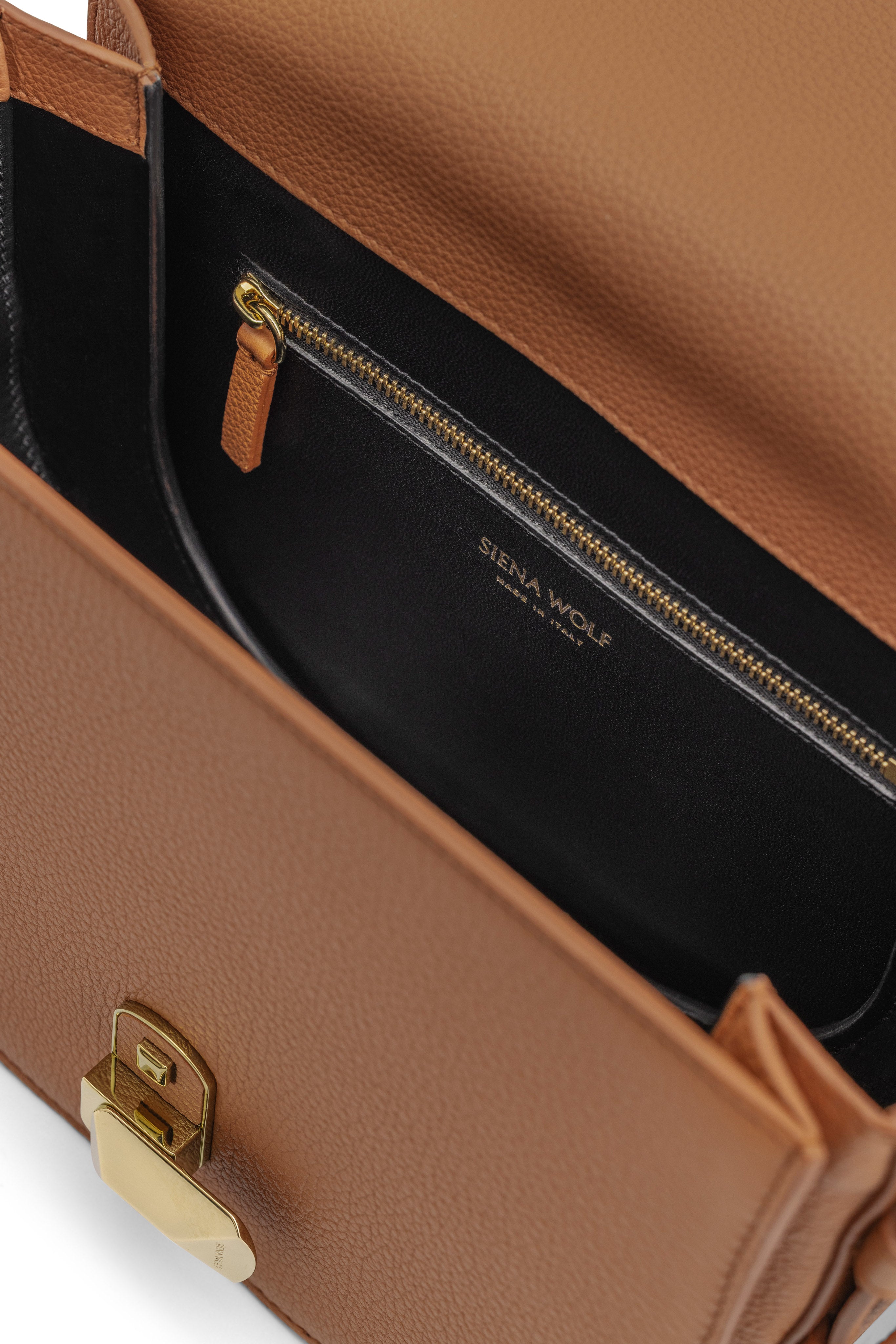 Side view of No. 18 chestnut crossbody bag showing interior
