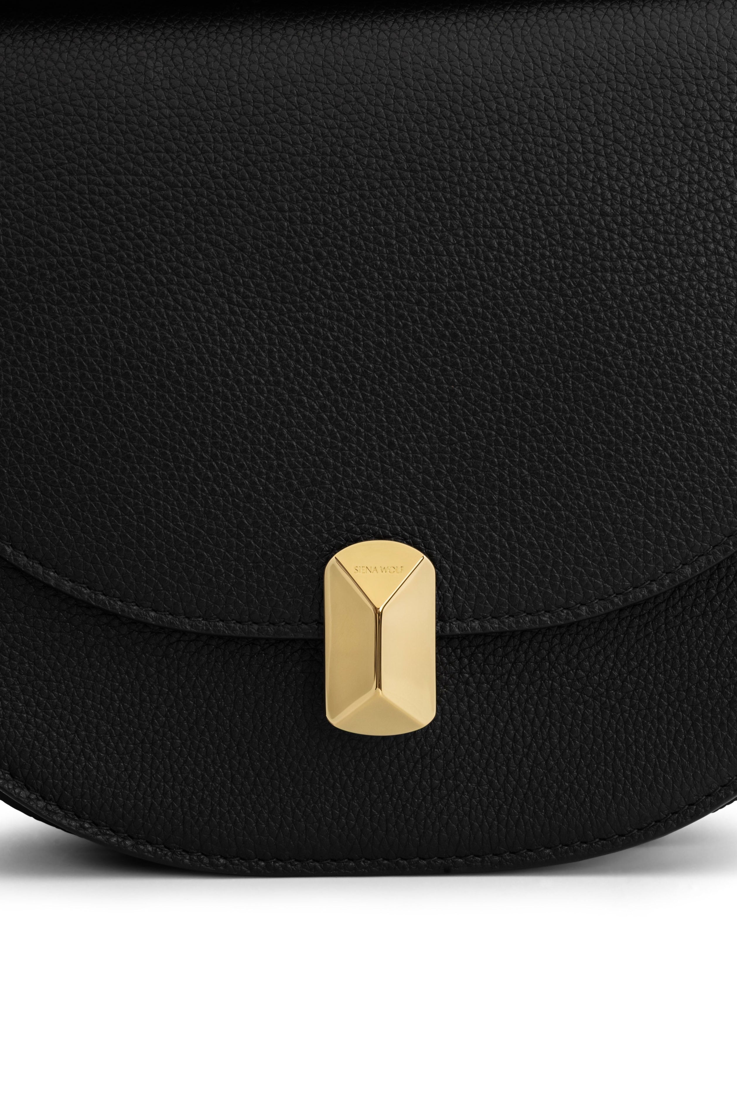 Close-up of black grain leather detail and custom turn-lock closure on No. 18 crossbody
