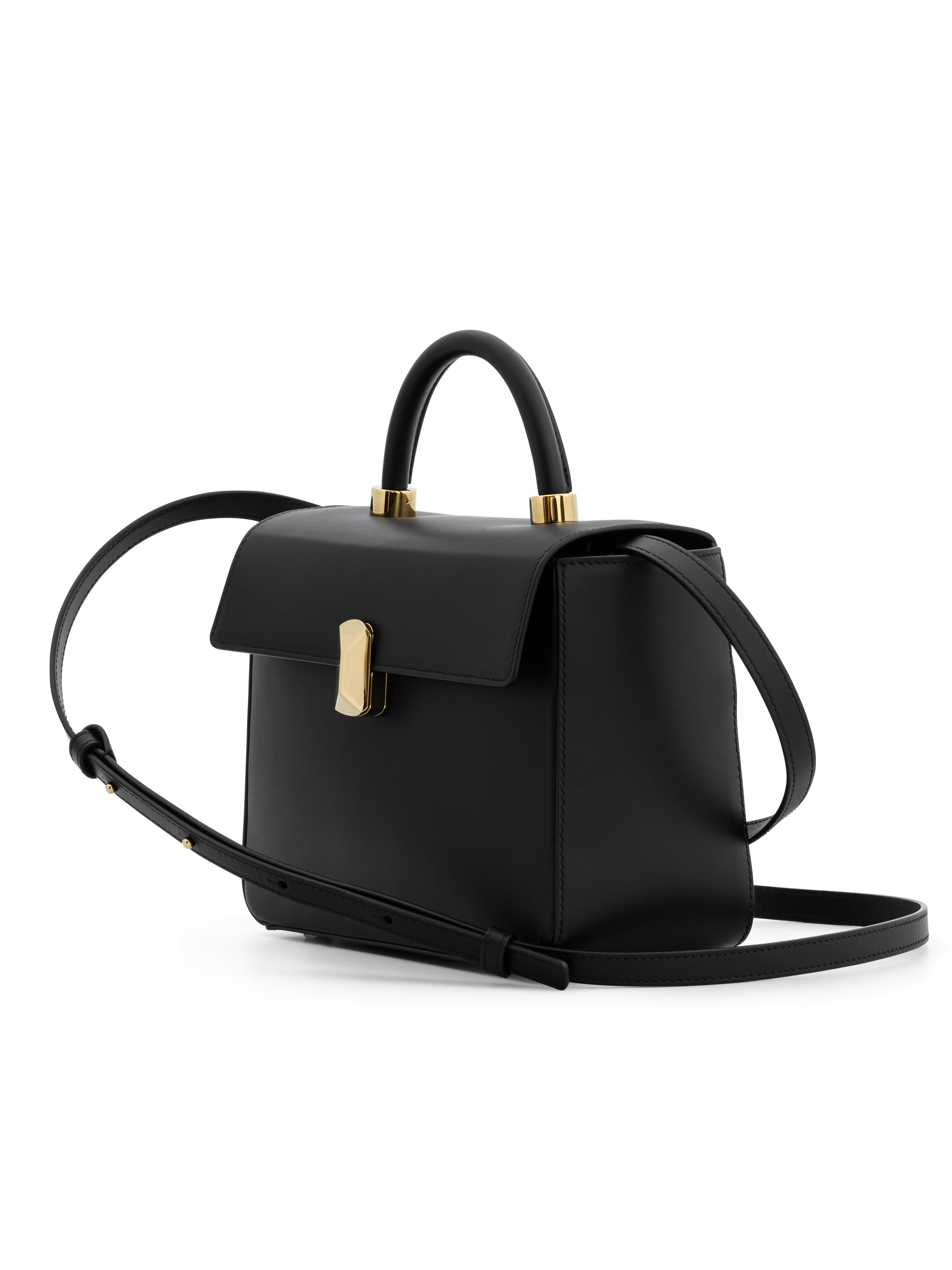 Side view of No. 16 classic top handle bag showing elegant silhouette
