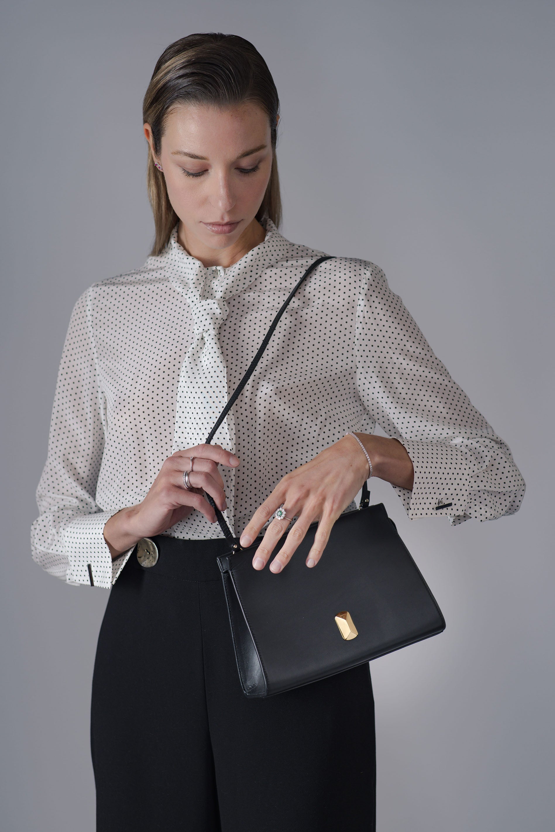 Woman wearing No. 17 small Italian leather shoulder bag
